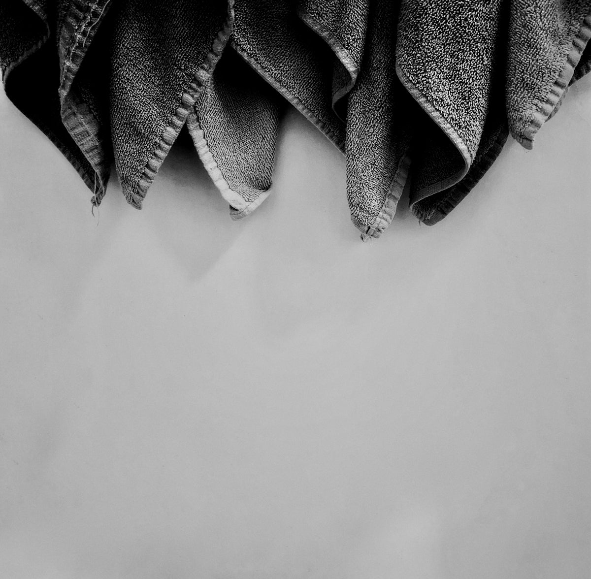 black and white textile on white surface