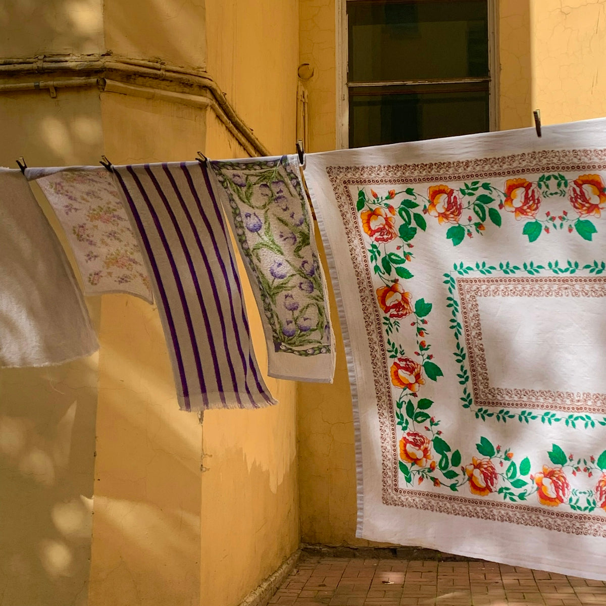 a couple of towels hanging from a clothes line