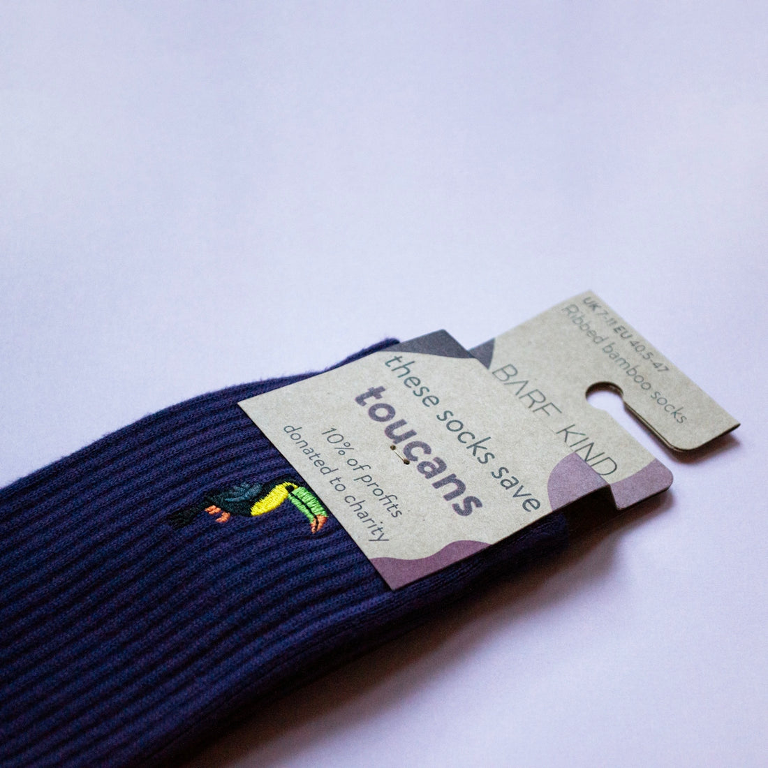 A pair of blue socks with a tag on it