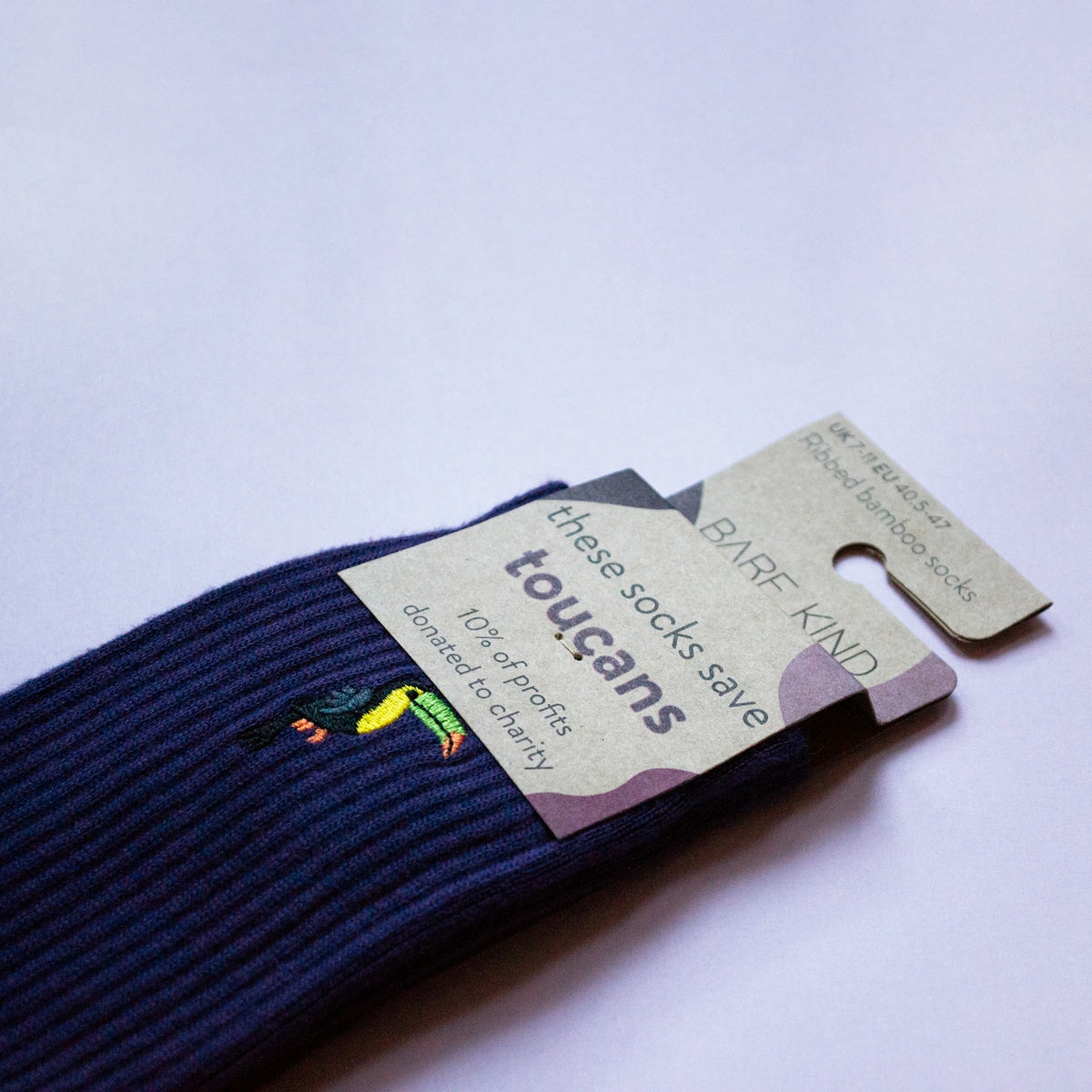 A pair of blue socks with a tag on it