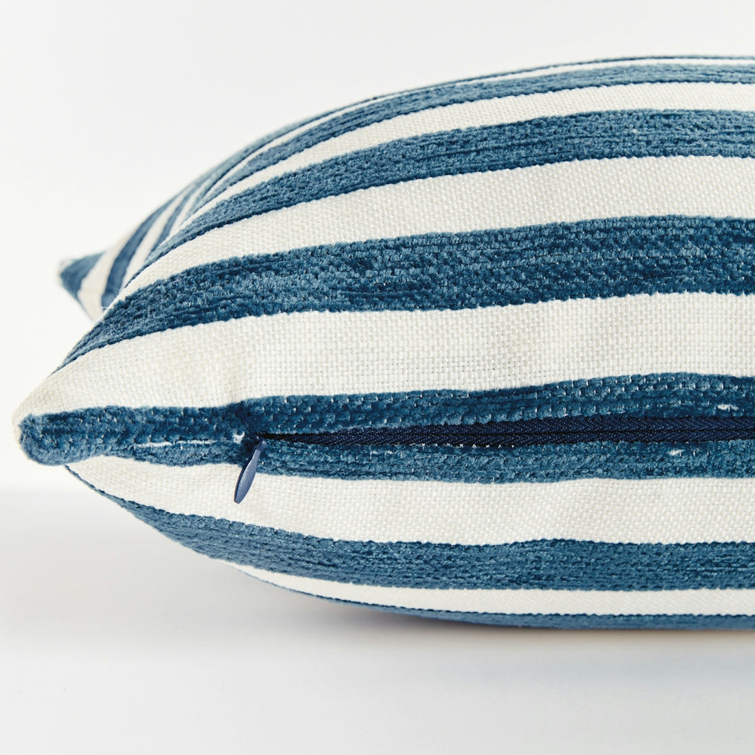 Close up of a blue and white striped pillow