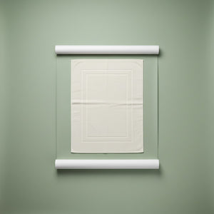 White textured bath mat on a green background