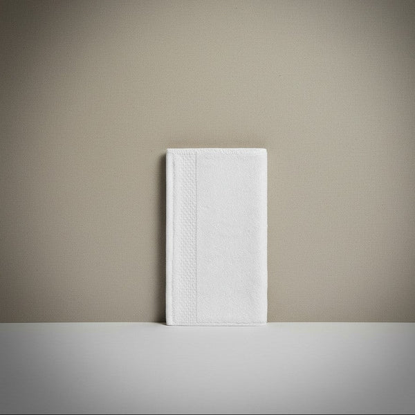 White notebook on a beige surface with a neutral background