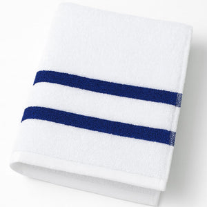 White towel with two blue stripes on a white background